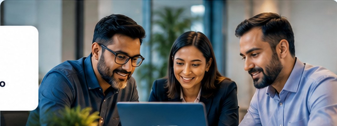 Professionals collaborating around a laptop